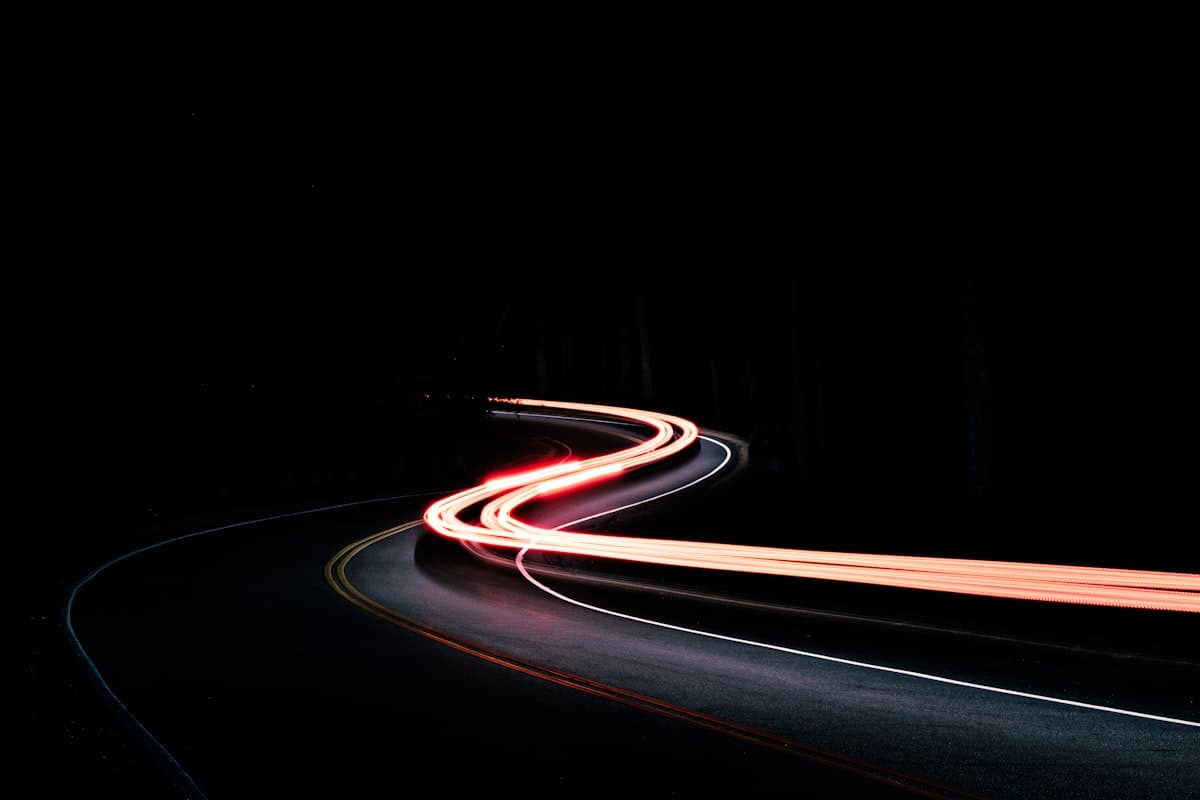 Light trails on a road at night representing a steady lead-generation pipeline